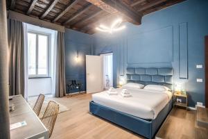 Capranica Private Suites客房内的一张或多张床位