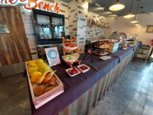 a buffet with fruits and vegetables on a table at H Boutique Peña Parda in La Herradura