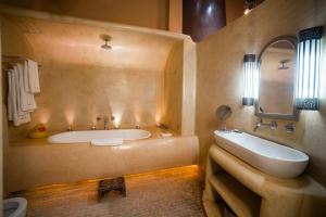 a large bathroom with a tub and a sink at MAISON MK Adults ONLY in Marrakesh