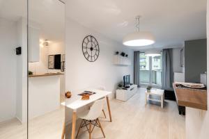 Kuchyňa alebo kuchynka v ubytovaní Waw Apartamenty Manhattan