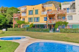 Bazén v ubytování Lujo y relax Reserva Higuerón Benalmádena Costa por Key-Wise nebo v jeho okolí