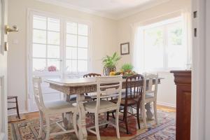 a dining room with a table and chairs at Casal de São José - Modern Country House in Mafra
