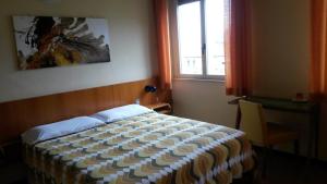 Кровать или кровати в номере Hotel Giardino
