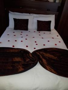 a bed with red hearts on it at ST ANNES PROFESSIONAL LET - BLACKPOOL in Blackpool