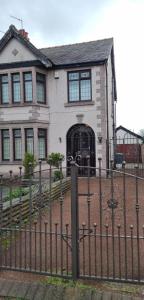a house with a fence in front of it at ST ANNES PROFESSIONAL LET - BLACKPOOL in Blackpool