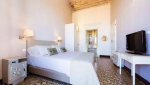 Cama ou camas em um quarto em Relais Santa Croce