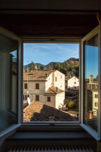 a view of a city from a window at In Palazzo Storico tra Firenze Bologna e Ravenna in Marradi