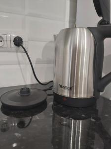 a coffee pot sitting on top of a counter at 2-х комнатная квартира in Taraz