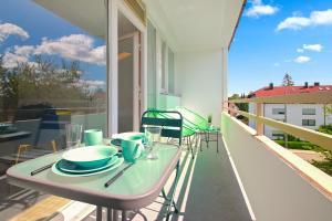 A balcony or terrace at Eddy's Rest & Relax - Munich East