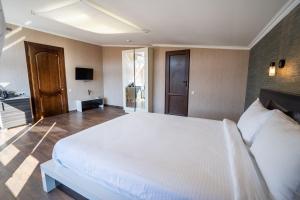 Postel nebo postele na pokoji v ubytování Siberia Hotel