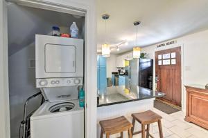 a kitchen with a washer and dryer and a refrigerator at PCB Group Retreat with Deck, 1 Block to Beach! in Panama City Beach