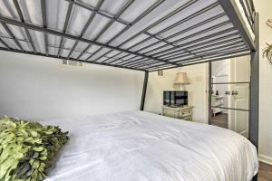 a bedroom with a large white bed with a ceiling at PCB Group Retreat with Deck, 1 Block to Beach! in Panama City Beach