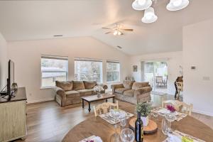 a living room with a couch and a table at Mount Shasta Escape with Balcony about Walk to Dtwn in Mount Shasta