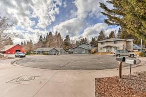 a parking lot with a car parked in a driveway at Mount Shasta Escape with Balcony about Walk to Dtwn in Mount Shasta