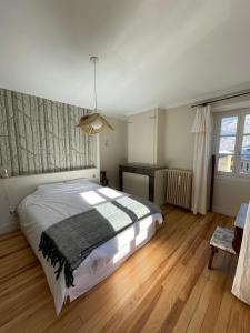 Llit o llits en una habitació de Chalet / Maison Bourgeoise entièrement rénovée