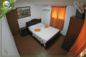 Un pat sau paturi într-o cameră la La Oliva Club Centro Campestre