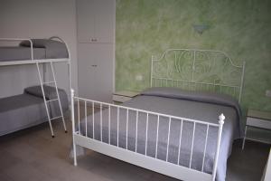 Postel nebo postele na pokoji v ubytování B&B Da Zio Peppe