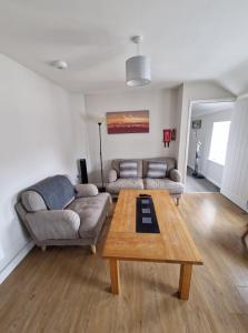 a living room with a couch and a coffee table at 4a Smart Apartments in Newark-on-Trent