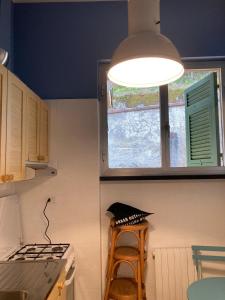Virtuvė arba virtuvėlė apgyvendinimo įstaigoje Aurea Bonassola