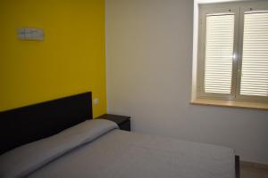 Postel nebo postele na pokoji v ubytování B&B Da Zio Peppe