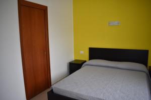 Postel nebo postele na pokoji v ubytování B&B Da Zio Peppe