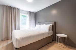 Llit o llits en una habitació de Condos Kamik Tremblant