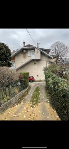 a house with a car parked in front of it at Joli T1 3* rénové mars 2022 proche lac et ville in Aix-les-Bains