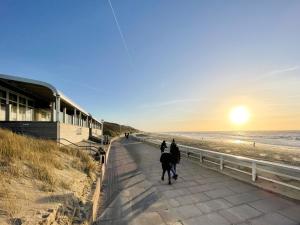 a group of people riding horses on the beach at Luxus-Loft-Sylt Haus Dünenburg in Westerland (Sylt)