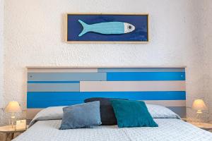 Tempat tidur dalam kamar di Ti porto al mare Apartment IUN P7641