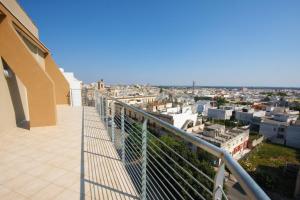 a balcony with a view of a city at Atmosphera in Galatina