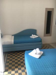 Krevet ili kreveti u jedinici u okviru objekta Hotel Italia