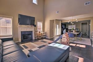 a living room with a couch and a fireplace at Family-Friendly Home in Hoover with Backyard! in Hoover