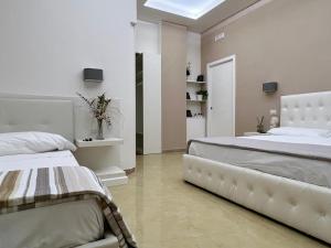 Postel nebo postele na pokoji v ubytování Pompei Royal House