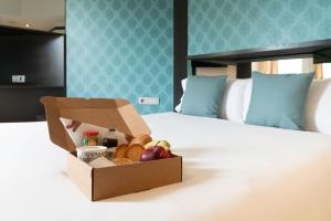 Posteľ alebo postele v izbe v ubytovaní Hotel Punt 14