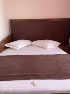 Postel nebo postele na pokoji v ubytování Ametist Casa Leului