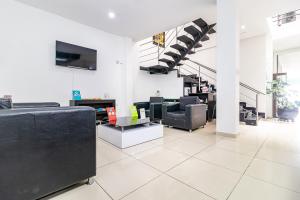 Μια τηλεόραση ή/και κέντρο ψυχαγωγίας στο Ayenda Quinta Estación