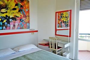Postel nebo postele na pokoji v ubytování Hotel Cristina