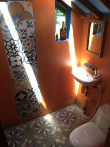 a bathroom with a sink and a shower at VH Surf Camp in Pacitan