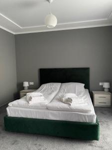 Ein Bett oder Betten in einem Zimmer der Unterkunft Garden Hall