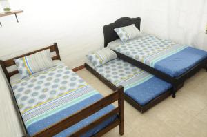 Gulta vai gultas numurā naktsmītnē Zarabanda Campestre - Moderna Casa Campestre para alojamiento y eventos
