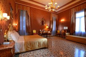 a hotel room with a bed and a couch at Residenza Hotel San Maurizio in Venice +37 photos