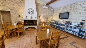 A restaurant or other place to eat at La Bastide Saint Bach