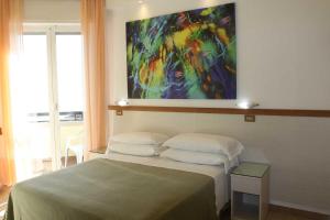 Postel nebo postele na pokoji v ubytování Hotel Cristina