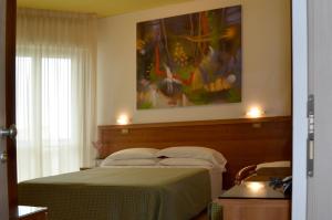 Postel nebo postele na pokoji v ubytování Hotel Cristina