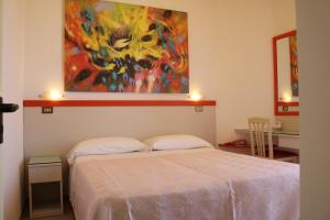 Postel nebo postele na pokoji v ubytování Hotel Cristina