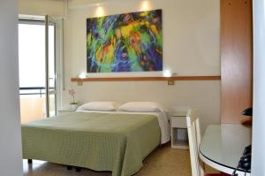 Postel nebo postele na pokoji v ubytování Hotel Cristina