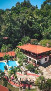 an aerial view of a resort with a swimming pool at Hotel El Jardin in Montezuma