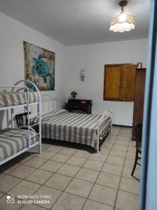 Postel nebo postele na pokoji v ubytování Al Vecchio Trullo