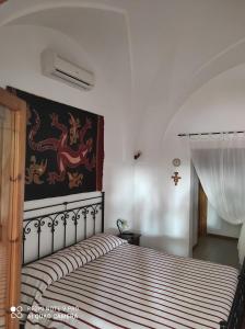 Postel nebo postele na pokoji v ubytování Al Vecchio Trullo