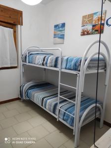 Postel nebo postele na pokoji v ubytování Al Vecchio Trullo
